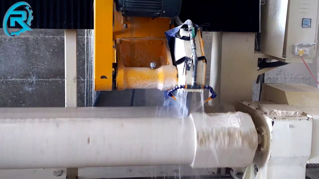 Stone column being shaped on a lathe